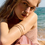 Editorial fashion lookbook featuring an elegant model showcasing a handcrafted minimalist silver necklace by Barcelona designer Júlia Duran.