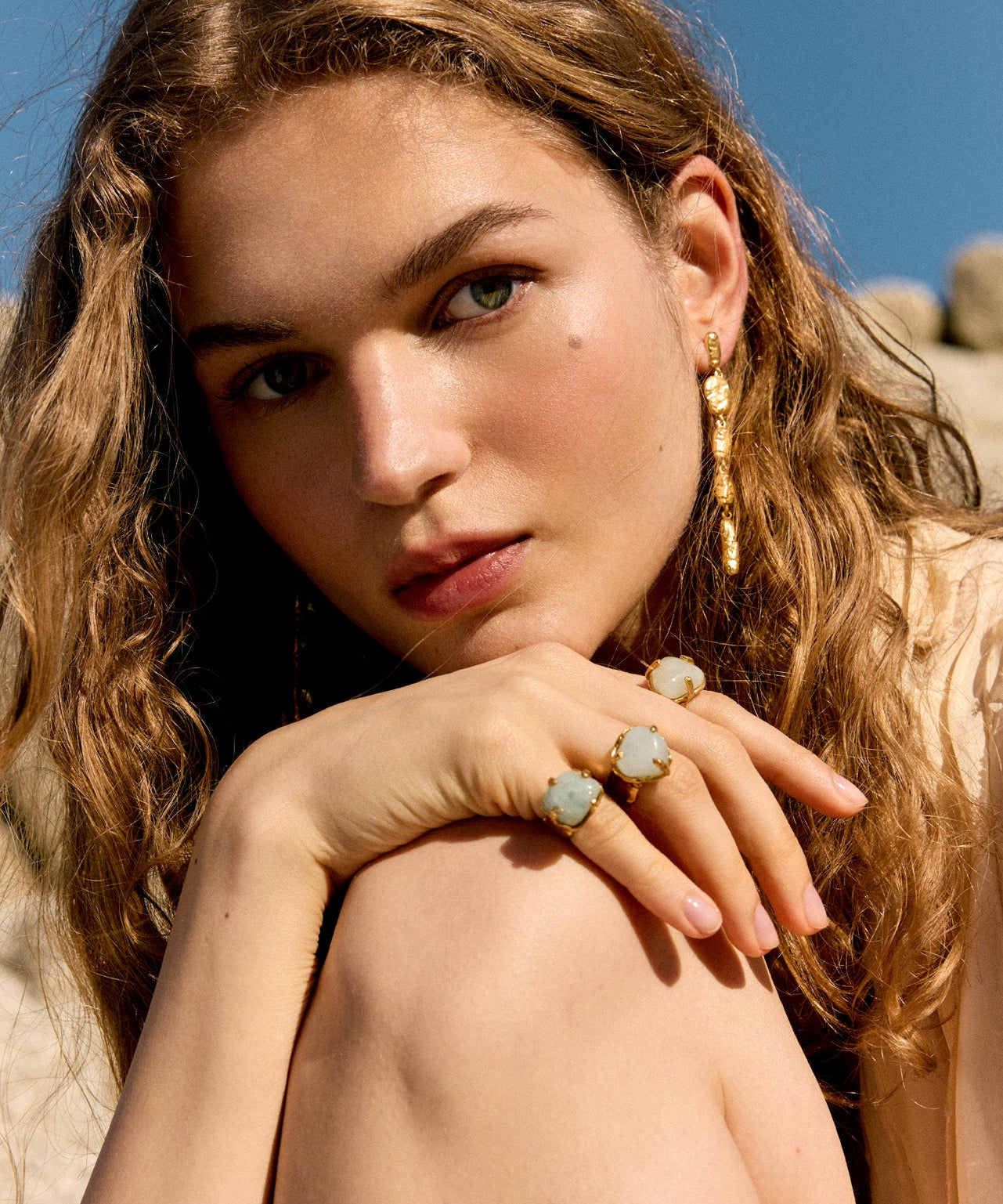 High-fashion campaign image displaying asymmetrical statement earrings, meticulously handmade in Barcelona by jewelry artist Júlia Duran.