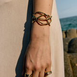 Lookbook-style fashion photography showcasing a matching earring and necklace set, sculpted by hand by Júlia Duran in Barcelona.