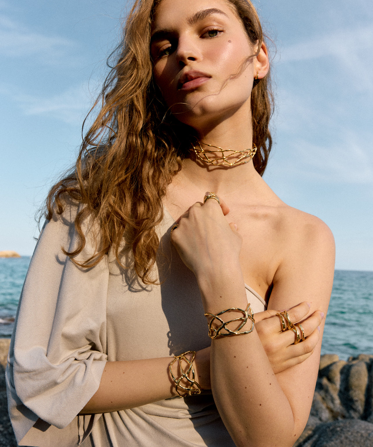 Artisanal jewelry pieces showcasing unique, organic textures designed by Júlia Duran in her Barcelona workshop.